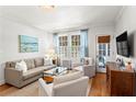 Cozy living room with ample natural light, neutral color palette, and hardwood floors at 8 Collier Nw Rd # A1, Atlanta, GA 30309