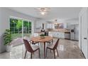 Eat in kitchen area with stainless appliances and tile floors at 1322 Thurgood Sw St, Atlanta, GA 30314