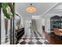 Elegant foyer with a black-and-white tiled floor and staircase at 1811 Fountain Hill Ct, Duluth, GA 30097