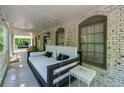 Inviting porch with a hanging swing bed, perfect for relaxing and enjoying the outdoors at 1811 Fountain Hill Ct, Duluth, GA 30097