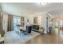 Spacious dining room featuring hardwood floors, decorative rug, stylish lighting, and elegant furniture at 1272 N Highland Ne Ave, Atlanta, GA 30306