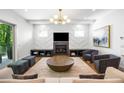 Stylish living room with fireplace, modern light fixture, and a comfortable seating area at 2641 Drew Valley Ne Rd, Brookhaven, GA 30319