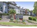 Exterior shot of Weatherstone Condominiums with well-manicured lawns and a sign at 1244 Weatherstone Ne Dr, Atlanta, GA 30324