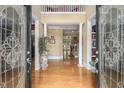 A grand entryway with hardwood floors, decorative doors, and views of the home's interior at 4855 Regency Sw Trce, Atlanta, GA 30331