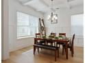 Traditional dining room with coffered ceiling, natural light, hardwood floors, and seating for six at 763 Arrendale Dr, Marietta, GA 30064