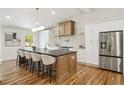 Gourmet kitchen boasts stainless steel appliances, custom cabinets, and an island with seating at 2327 Doreen Ne Ct, Atlanta, GA 30345