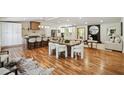 Spacious kitchen with large island, modern appliances, hardwood flooring, and open floor plan to living and dining areas at 2327 Doreen Ne Ct, Atlanta, GA 30345