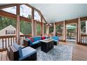 Relaxing sunroom with comfortable seating, a modern fire pit, and lots of natural light at 96 Grover Way, Dallas, GA 30157