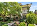 Charming two-story home entrance with a covered porch, detailed landscaping, and inviting walkway at 1601 Marlbrook Ne Dr, Atlanta, GA 30307