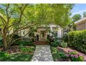 Charming home entrance featuring a covered porch, meticulous landscaping, and a welcoming walkway at 1601 Marlbrook Ne Dr, Atlanta, GA 30307