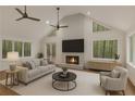 Bright living room boasts a fireplace with television, modern furniture, and plenty of natural light at 535 Emerald Pkwy, Sugar Hill, GA 30518