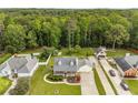 Aerial view of a charming neighborhood with mature trees surrounding well-maintained homes at 1320 Pinyon Pl, Lawrenceville, GA 30043