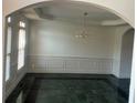 Elegant dining room with decorative crown molding, chair rail and lots of natural light at 240 Flowers Cove Ln, Lilburn, GA 30047