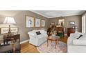 Cozy living room featuring neutral paint, wood floors, and ample natural light at 1328 Wyntercreek Rd, Atlanta, GA 30338