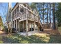 Backyard with a screened porch on the main level, a ground level patio, and a grassy area at 5 Renfroe Ct, Decatur, GA 30030