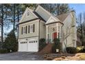 Two story home with a two-car garage, brick stairs to the front door, and a screen porch on the side at 5 Renfroe Ct, Decatur, GA 30030