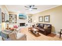 Inviting living room with built-in bookshelves, fireplace, and hardwood flooring at 1894 Whitehawk Ct, Lawrenceville, GA 30043