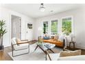 Cozy living room featuring modern decor, hardwood floors, and plenty of natural light at 1395 Hartford Sw Ave, Atlanta, GA 30310