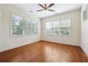 Bright bedroom with hardwood floors, a ceiling fan and large windows offering ample natural light at 1410 Bluestone Dr, Cumming, GA 30041
