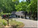 Inviting one-story home with a cozy front porch and mailbox at 165 Holly Ct, Loganville, GA 30052