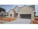 Charming single-story brick home featuring a two-car garage and inviting entrance at 3708 Southfield Ct, Loganville, GA 30052