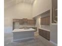A new kitchen featuring light wood cabinetry, a kitchen island, and white countertops at 3708 Southfield Ct, Loganville, GA 30052