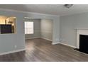 Spacious living room with updated flooring, fireplace and neutral color palette at 4817 Hidden Creek Place, Decatur, GA 30035