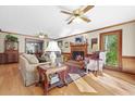 Cozy living room features hardwood floors, fireplace, and natural light at 1488 Rivermist Sw Dr, Lilburn, GA 30047