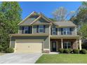 Attractive two-story home with a well-maintained lawn, showcasing its charming curb appeal at 158 Grove Meadow Dr, Acworth, GA 30101