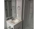 Bathroom featuring a vanity with a mirror, alongside a shower and tub combination at 2858 Davidson Dr, Lithonia, GA 30058