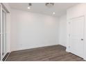 Bright bedroom with neutral walls, wood floors, and large windows allowing for natural light at 111 Iveybrooke Ln # 60, Alpharetta, GA 30009