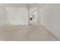 Spacious living room with white walls, wainscotting detail, and a view into the future kitchen at 117 Owens Mill Pl, Canton, GA 30115