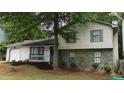 Charming two-story home with stone accents, well-maintained lawn, and inviting curb appeal at 6193 Charring Cross Ct, Lithonia, GA 30058