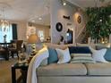 Cozy living room with comfortable sofa, throw pillows, and stylish decor at 6193 Charring Cross Ct, Lithonia, GA 30058