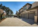 Spacious three-car garage with a long drive, plus basketball court at 1160 Lake Shore Overlook, Alpharetta, GA 30005