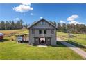 Beautiful barn home with spacious yard, RV parking, and easy access to a maintained gravel driveway at 96 Landers Ne Rd, Rydal, GA 30171