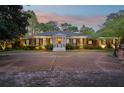Elegant brick home featuring classic architecture, manicured landscaping, and a spacious driveway at 289 W Paces Ferry Nw Rd, Atlanta, GA 30305