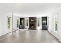 Spacious living room with a cozy fireplace, built-in shelving, and plenty of natural light at 3007 Octavia Cir, Marietta, GA 30062