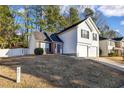 A charming two-story home with a two-car garage and a well-manicured lawn in a residential neighborhood at 939 Redan Trce, Stone Mountain, GA 30088