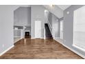 Spacious living room with hardwood floors, vaulted ceiling, fireplace, and lots of natural light at 939 Redan Trce, Stone Mountain, GA 30088