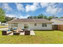 Spacious backyard with patio featuring an outdoor seating area at 1626 Cobbs Creek Ln, Decatur, GA 30032