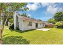 Well maintained backyard with green grass and concrete patio at 1626 Cobbs Creek Ln, Decatur, GA 30032