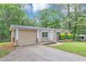 Attractive single-story home featuring an attached garage and stone details at 5326 Highway 5, Douglasville, GA 30135