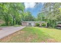 Inviting single-story home with a spacious front yard and convenient driveway access at 5326 Highway 5, Douglasville, GA 30135