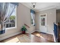Inviting entryway features gleaming hardwood floors, elegant trim, and abundant natural light at 265 Trecastle Sq, Canton, GA 30114