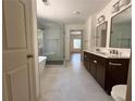Modern bathroom with a separate shower and a luxurious soaking tub, providing a spa-like experience at 70 Gardenia Nw Dr, Atlanta, GA 30314
