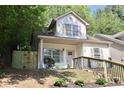 Charming home with a picket fence and landscaped yard offers curb appeal and privacy at 70 Gardenia Nw Dr, Atlanta, GA 30314