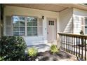 Up close front porch featuring well manicured landscaping and detailed trim at 70 Gardenia Nw Dr, Atlanta, GA 30314