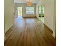 Bright living room featuring hardwood floors and a sliding glass door, creating a warm and inviting atmosphere at 70 Gardenia Nw Dr, Atlanta, GA 30314