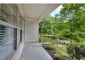 Inviting porch with black aluminum railing and lush green views at 70 Gardenia Nw Dr, Atlanta, GA 30314